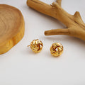 Twelve Gold Tone Sculptural Knot and Hoop Earring Collection view 8