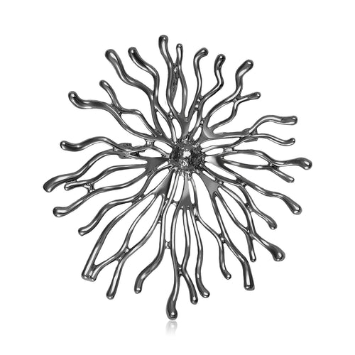 Radiating Sunburst brooch In Four Metal Tone Designs shown in styled product arrangement