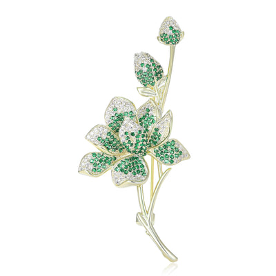 Green and clear pave crystal magnolia branch brooch front view