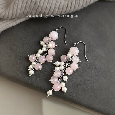 Pink crystal pearl cluster tassel drops on gray fabric tray