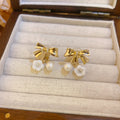 Bow Flower and Pearl Drop Ear Clips in Gold and Silver view 7