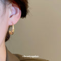 Gold Tone Sculpted Crescent Hook Earrings with Detailed Finish view 3