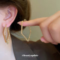 Textured Diamond Shape Hoop Earrings in Silver Tone view 1