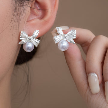 Silver Tone Bow and White Pearl Look Small Stud Earrings