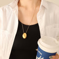 Polished Oval Pebble Pendant Necklace Long Box Chain Metal view 1