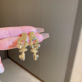 Gold Tone Cascading Leaf Stud Earrings with Polished Metal Finish view 2