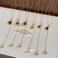Gold Tone Fine Chain Necklace With Brown Heart Pendant view 2
