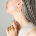 Large Twisted Flat Circular Hoop Earrings Gold And Steel Tone view 4