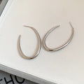 Tapered Open Hoop Earrings in Gold Tone or Silver Tone view 7