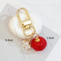 Wool Felt Ball Keychain With White Enamel Flower Charm And Gold-Tone Clasp view 4