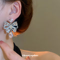 Silver Tone Crystal Bow Stud Earrings With Pink Teardrop Accents view 3