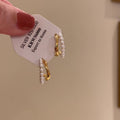 White Pearl Double Row Gold Tone Huggie Earrings With Metal Details view 3