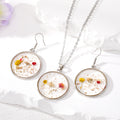 Silver Tone Round Pressed Flower Resin Necklace and Earring Options in Four Designs view 2