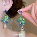 Faceted Crystal Floral Drop Stud Earrings with Polished Metal Tone Details view 3