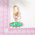Gold Tone Exploding Evil Eye Clip Keychains in Five Colors view 5