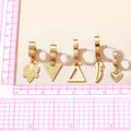 Gold Tone Heart Feather Leaf and Triangle Huggie Drop Earrings view 4