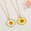 Gold Tone Round Pressed Daisy Resin Pendant Necklaces in Two Colors view 1