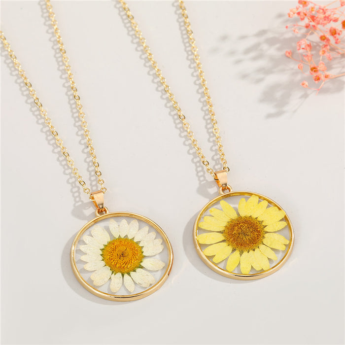 Gold Tone Round Pressed Daisy Resin Pendant Necklaces in Two Colors