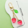 Strawberry Charm Keychains Featuring Magenta Strawberry Across 15 Pictured Variations view 3