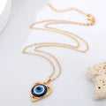 Heart Outline Blue Evil Eye Pendant Necklaces in Two Finishes view 3
