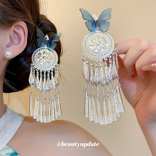 Blue butterfly silver filigree tassel hair clip worn and held beside head