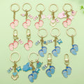 Baby Shower Charm Keychains Featuring Blue Feet Ring Across 14 Pictured Variations view 1