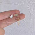 Gold Tone Bow And White Heart Asymmetric Stud Earrings view 4