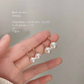 Gold Tone White Pearl Drop Stud Earrings In Small And Large Sizes view 1