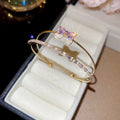 Double Band Bow Open Bangle In Iridescent Gold Gold Or Silver Tone view 6