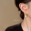 Gold Tone Molten Texture Stud Earrings With Pearl Drop view 2