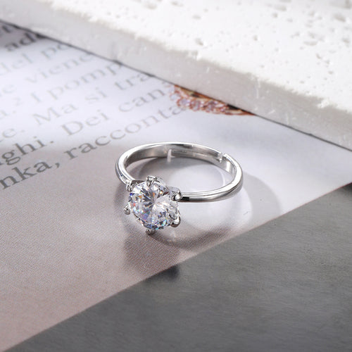 Close-up showing the colors and surface details of gold and Silver Tone Solitaire Crystal Adjustable Rings