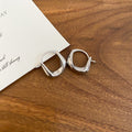 Polished U Shape Huggie Earrings in Silver and Gold Tones view 6