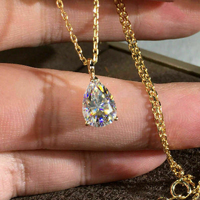 Product view showing gold-tone pear-shaped clear solitaire pendant necklace
