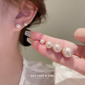 Pink Pearl Stud Earrings with Gold Tone Posts with Polished Metal Accents view 2
