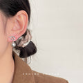 Silver Tone Knot Pearl Like Stud Earrings In White And Gray view 2