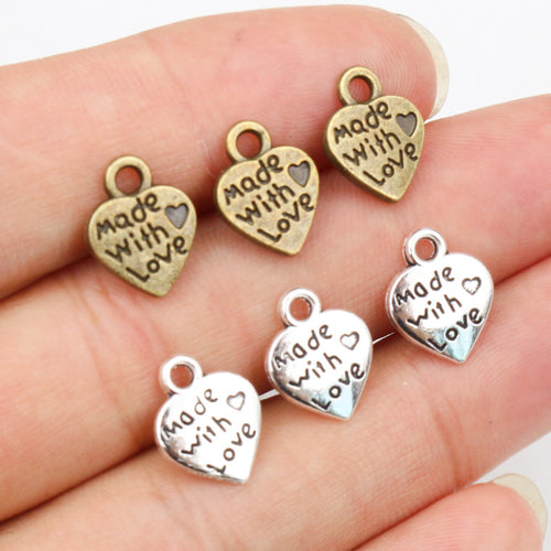 Made With Love Heart Alloy Charms in Two Finishes, grouped overview on a plain background