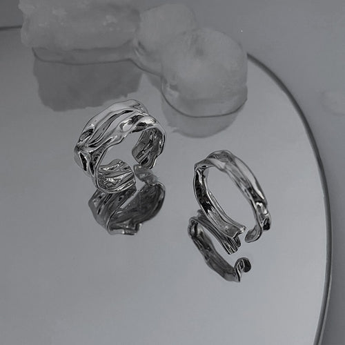 two-piece sculpted open ring set with flowing metal texture shown worn in a styled second view