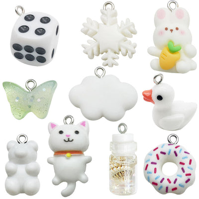 White bear charms arranged on a light background