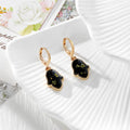 Gold Tone Pressed Flower Hamsa Huggie Earrings in Nine Options view 7