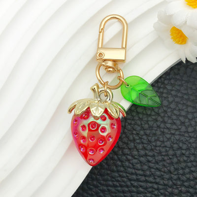 Overview showing the available color and design variations of the resin strawberry metal clasp keychain