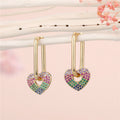 Gold Tone Rectangular Huggie Earrings with Crystal Charm Drops view 3