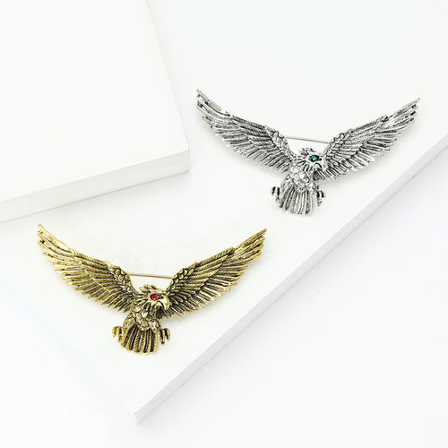 Grouped view of spread Wing Eagle Brooch in Antique Gold or Silver Tone arranged together.