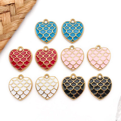 Colorful heart charms arranged on a light background