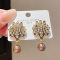 Gold Crystal Scroll Earrings With Brown Pearl Drops view 4
