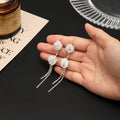 White Mesh Rose and Silver Tone Chain Tassel Earrings view 3