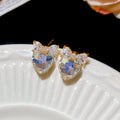 Gold Tone Crystal Heart Stud Earrings with Bow Details view 7