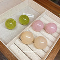 Translucent Round Resin Stud Earrings in Cream and Green view 2