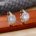 Round Halo Hinged Hoop Earrings In Polished Gold And Silver Tones view 4