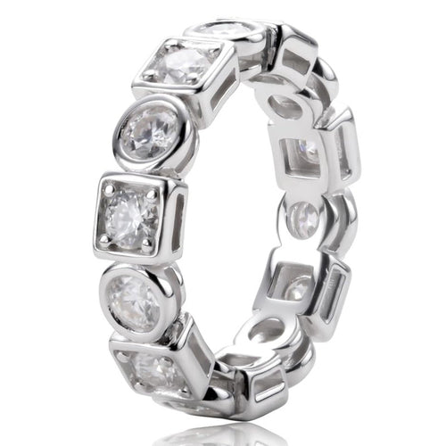 Close product shot of white gold round square stone eternity ring