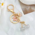 Cherry Charm Keychain with Enamel Butterfly and Daisy Flower Pendant view 11